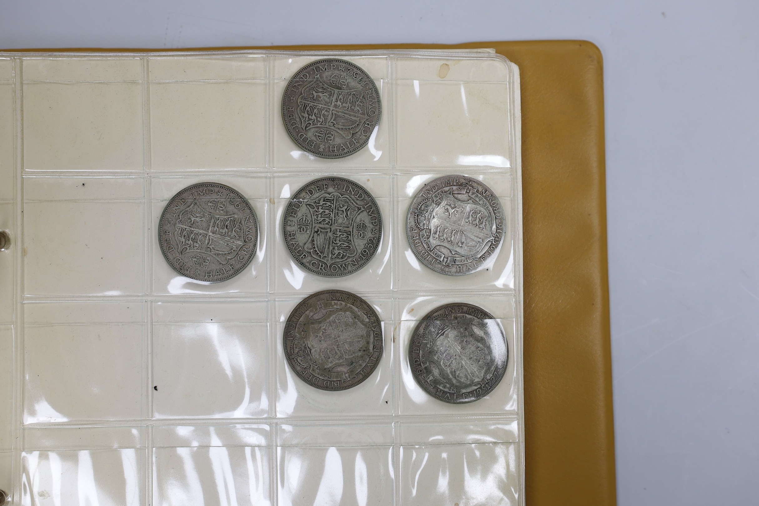 Two albums of UK coins, George III to George VI to include 1921 to 1946 halfcrowns, 1807 penny VF, 1805 Irish halfpenny AVF, a 'Revolution Jubilee 1788' medal etc